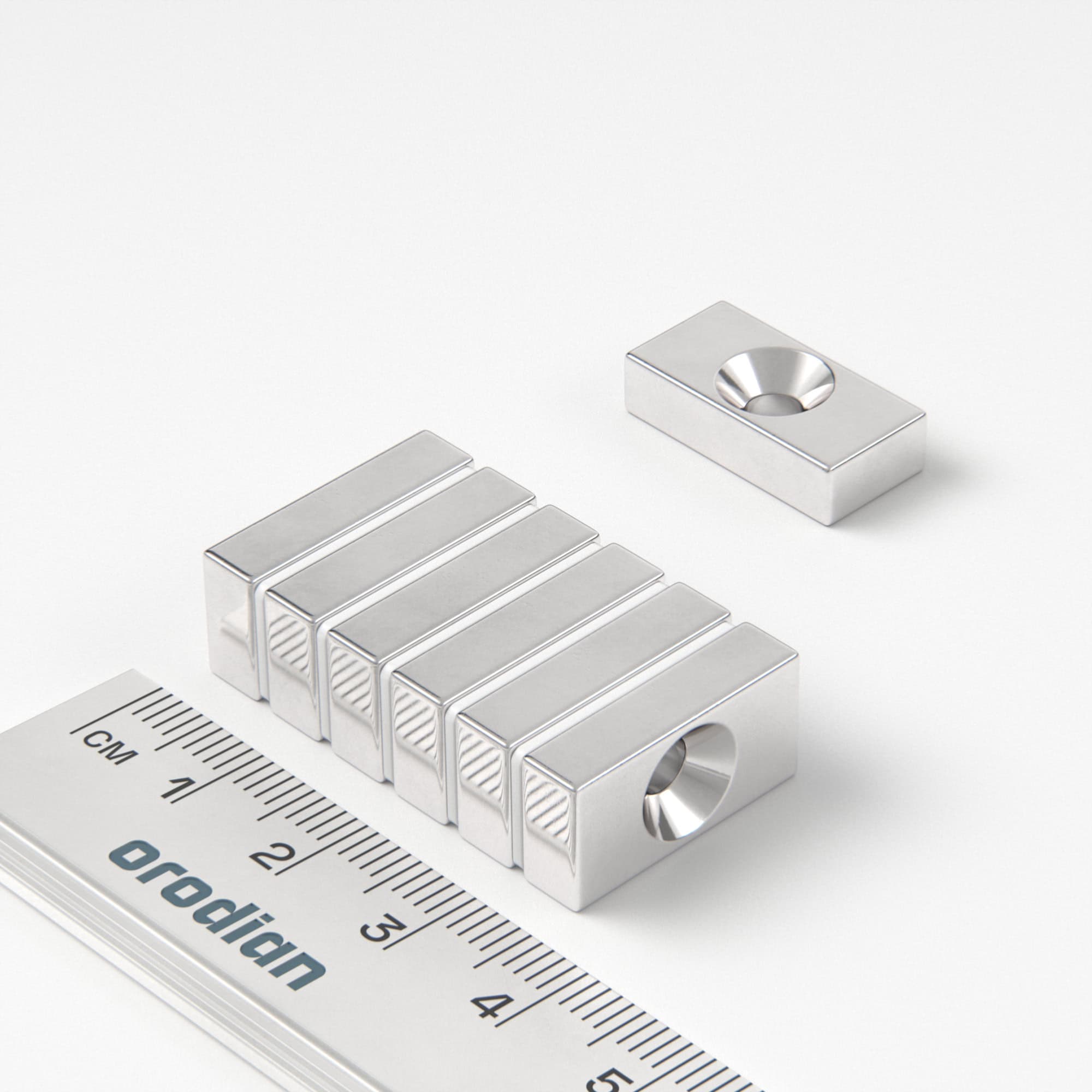Neodymový magnet kvádr 20×10×5 mm s dírou M4 (severní pól na straně s prohlubní) - N38