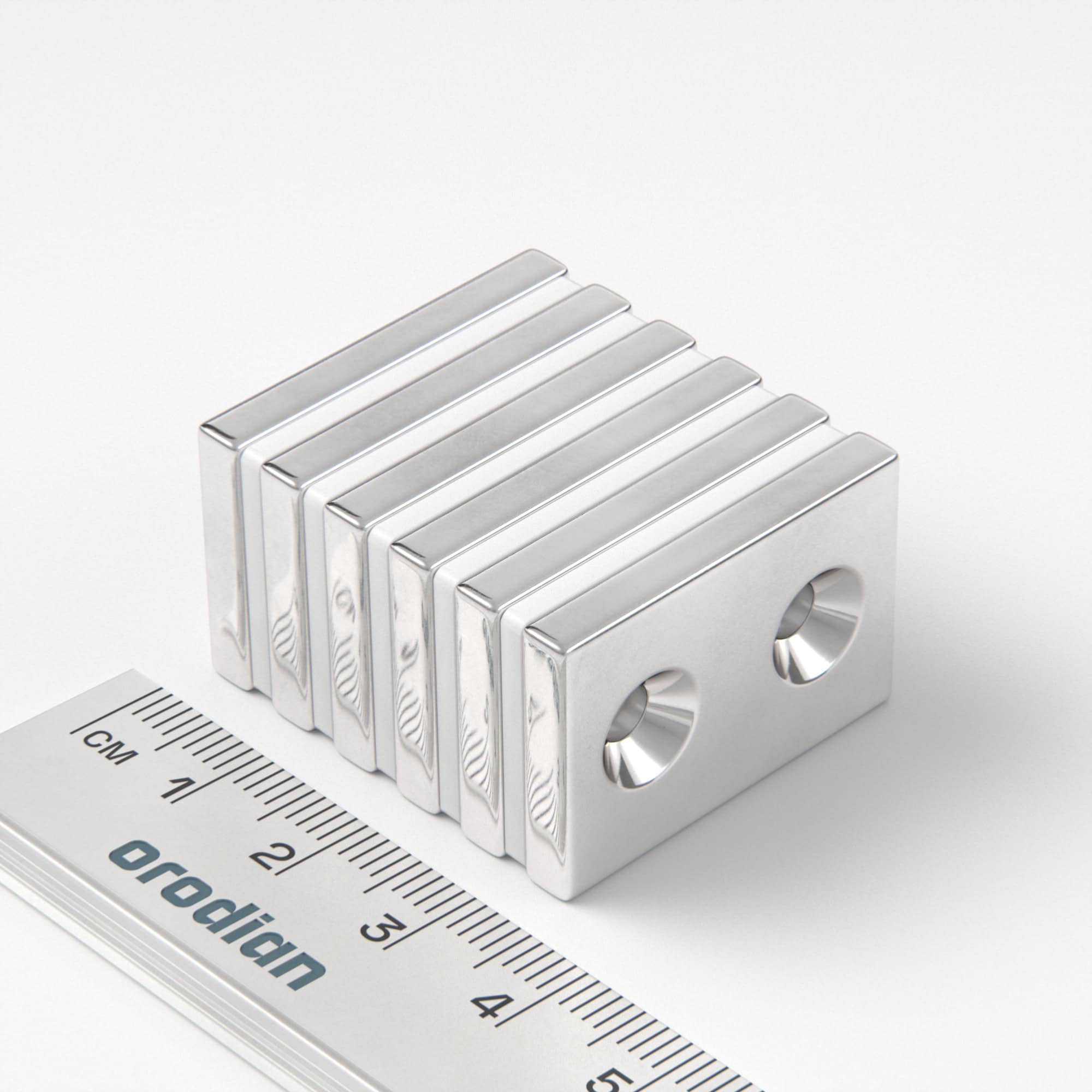 Neodymový magnet kvádr 30×20×4 mm s 2 dírami M4 (severní pól na straně s prohlubněmi) - N38