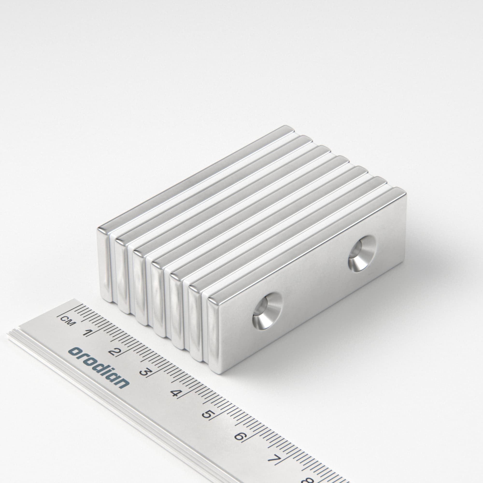 Neodymový magnet kvádr 60×20×4 mm s 2 dírami M4 (jižní pól na straně s prohlubněmi) - N38