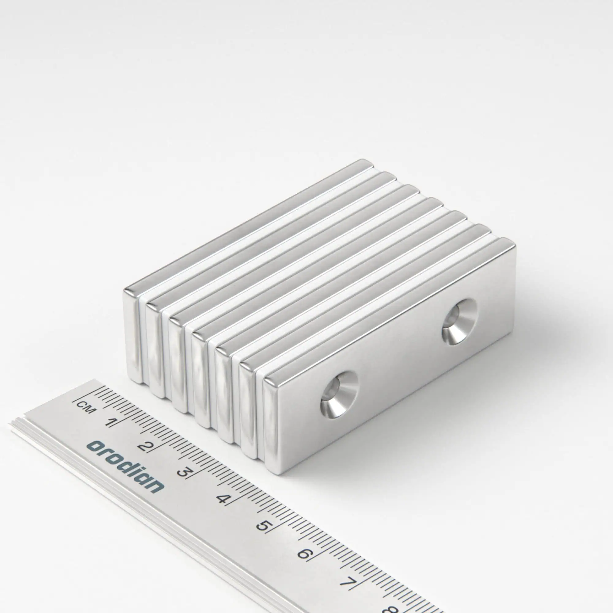 Neodymový magnet kvádr 60×20×4 mm s 2 dírami M4 (severní pól na straně s prohlubněmi) - N38
