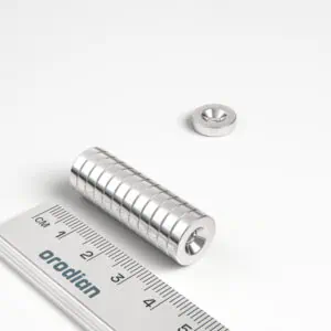 Neodymový magnet válec 12×3 mm s dírou M3 (jižní pól na straně s prohlubní) - N38