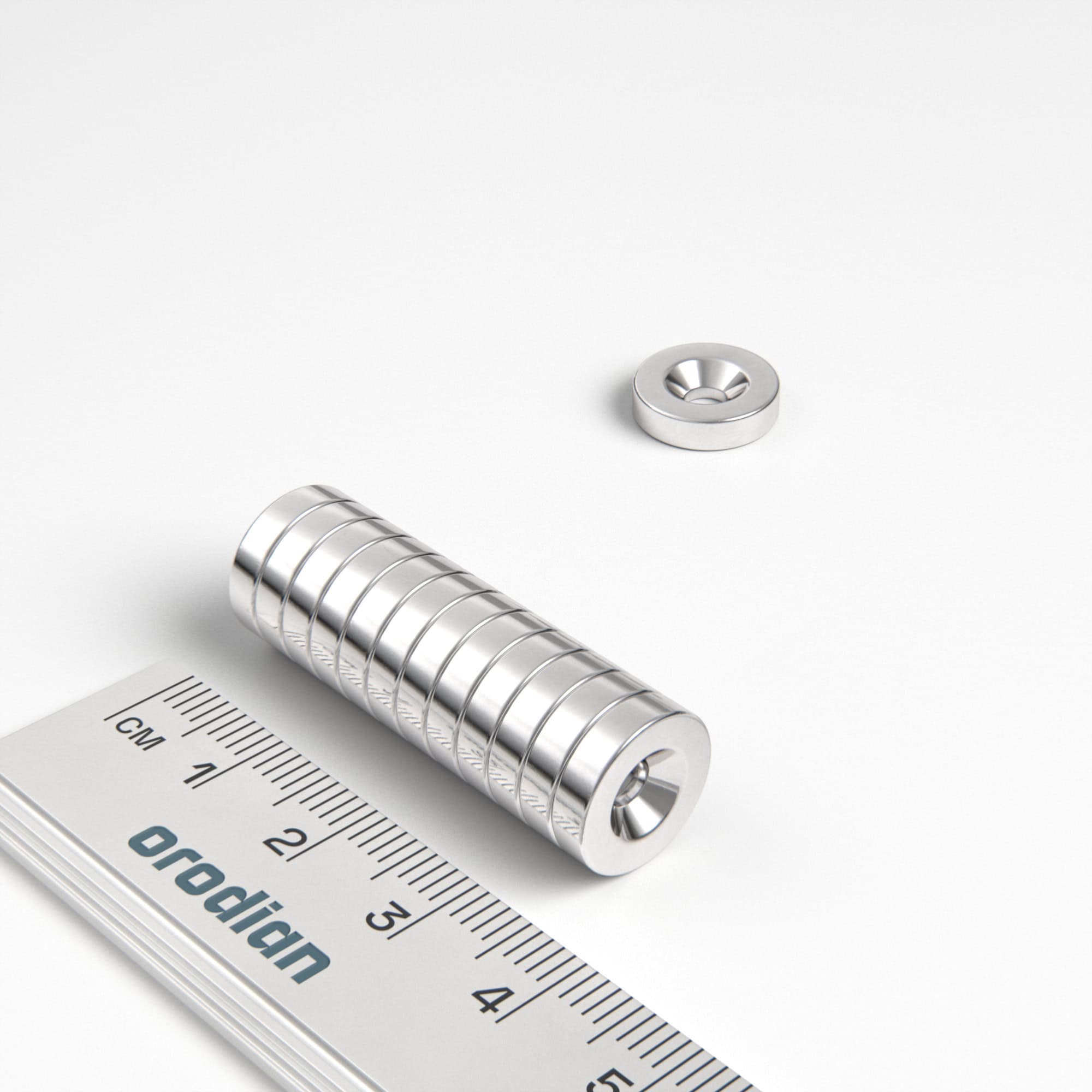 Neodymový magnet válec 12×3 mm s dírou M3 (severní pól na straně s prohlubní) - N38